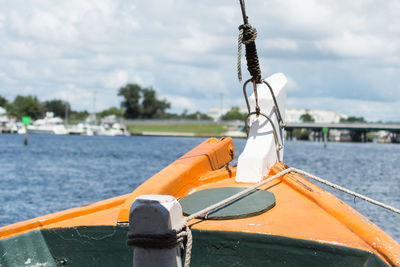 Cropped image of motorboat on sea against sky