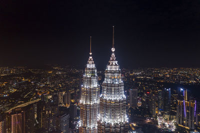 Illuminated buildings in city at night