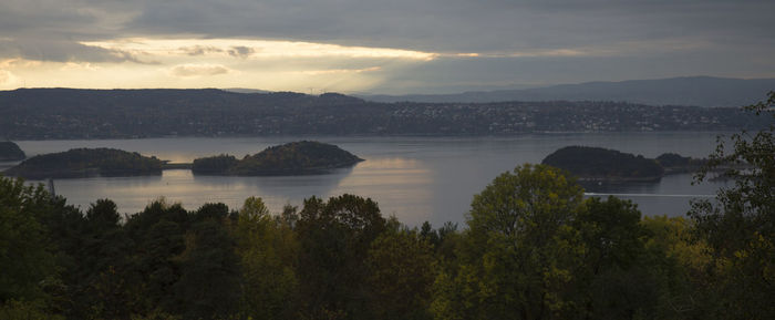 Scenic view of lake against sky during sunset