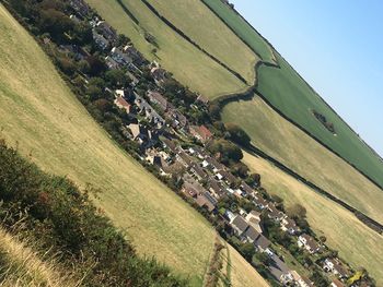 High angle view of buildings on field against sky