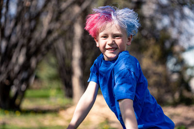 Young boy jumping and playing cheerfully