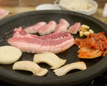 Close-up of meat in cooking pan