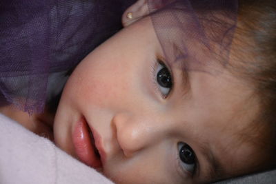 Close-up portrait of baby girl relaxing