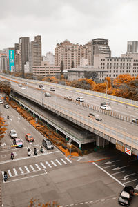 High angle view of railroad tracks in city against sky