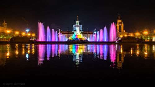 Illuminated buildings in city at night