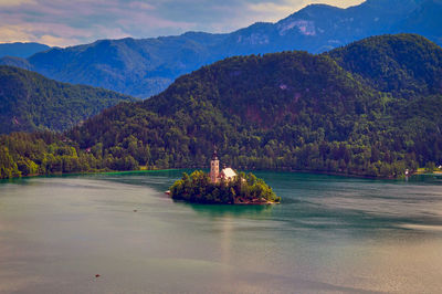 Scenic view of lake and mountains against sky