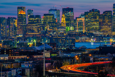 High angle view of illuminated city buildings at night