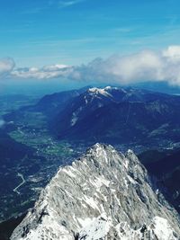 Scenic view of snowcapped mountains against sky