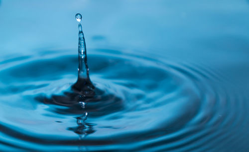 Close-up of drop splashing in water