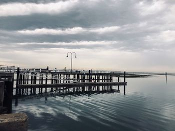 Pier over sea against sky