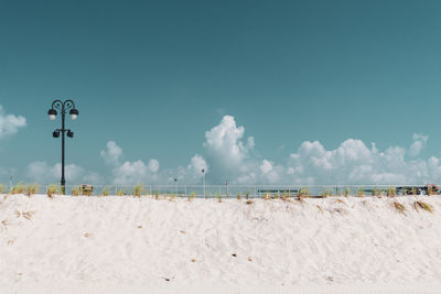 Scenic view of beach against blue sky