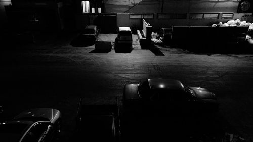 Vehicles on street in the dark