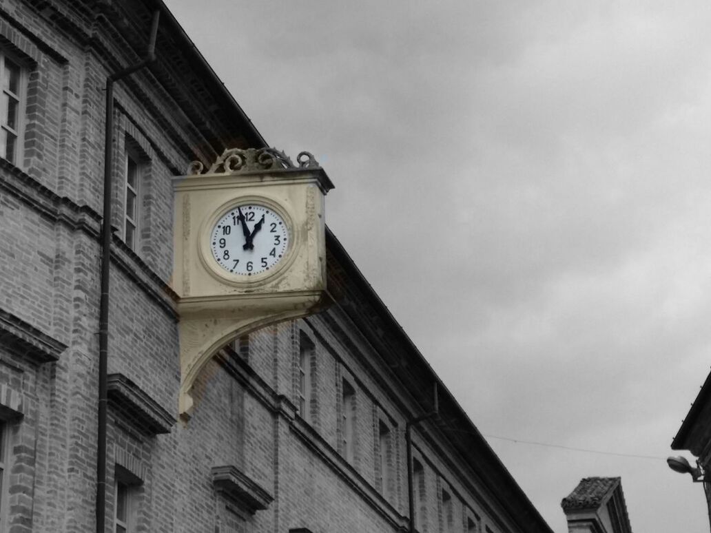 low angle view, architecture, built structure, building exterior, sky, clock, time, cloud - sky, clock tower, high section, religion, outdoors, cloud, no people, day, church, cloudy, building, history