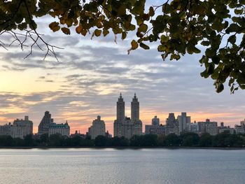 Buildings in city at sunset