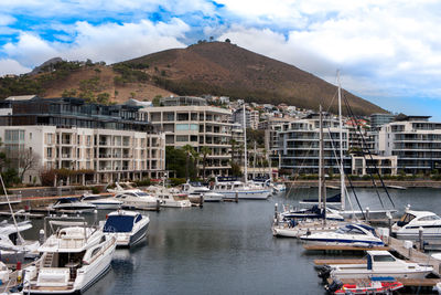 Boats moored at harbor