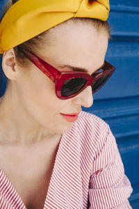 Close-up of woman in headband and sunglasses