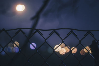 Close-up of illuminated lighting equipment at night