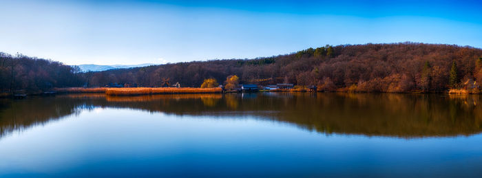 Autumn panorama with windmills on lake, sibiu, romania