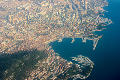 Aerial view of sea and cityscape