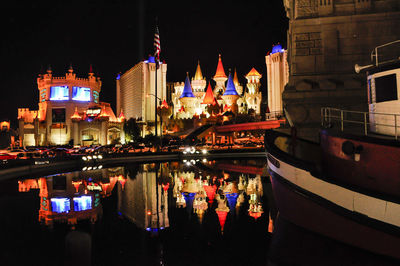 Reflection of illuminated buildings in canal at night