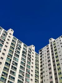 Contrast of blue winter sky and apartment