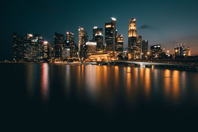 Illuminated buildings in city at night