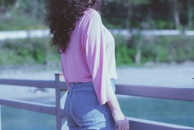 Rear view of woman standing outdoors