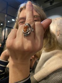 Midsection of woman holding glass