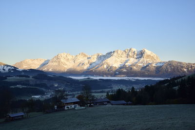 Scenic view of snowcapped mountains against clear sky