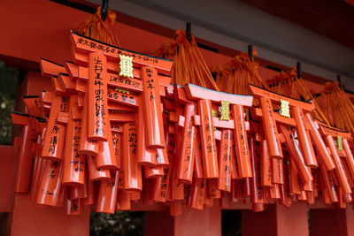 Low angle view of tori gate decoration hanging in temple
