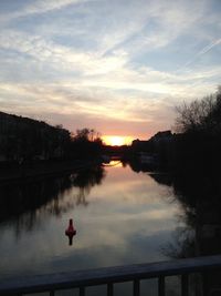 Scenic view of river at sunset