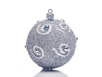 Close-up of christmas decorations over white background