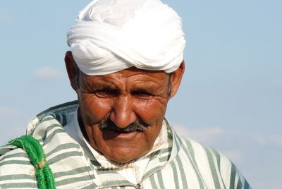 Portrait of man wearing sunglasses against sky