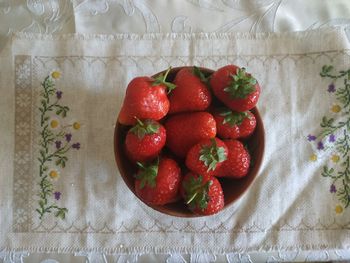 High angle view of strawberries on table