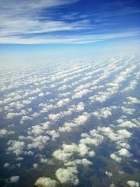 Aerial view of landscape against cloudy sky