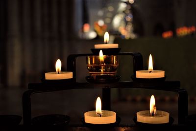 Close-up of tea light candles at altar