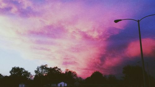 Low angle view of building against cloudy sky
