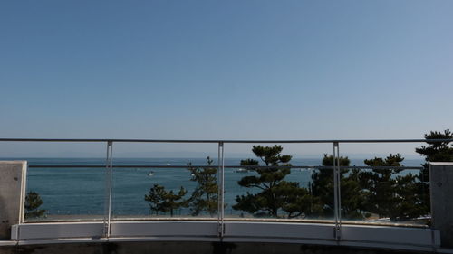 Scenic view of sea against clear blue sky