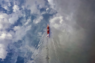 Low angle view of flag on mountain against sky