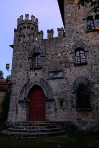 Low angle view of old building against sky