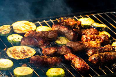 High angle view of meat on barbecue grill