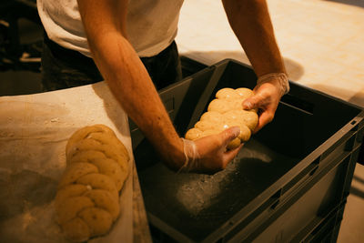 Midsection of man preparing food