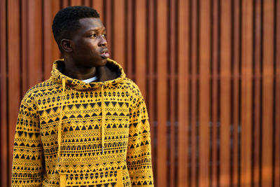 Portrait of young man looking away