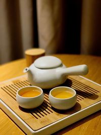 Close-up of tea cup in tray on table