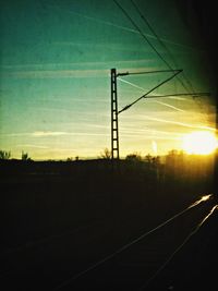 Electricity pylon at sunset