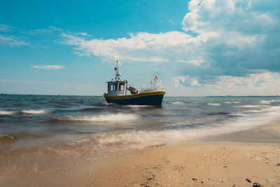 Boat in sea against sky