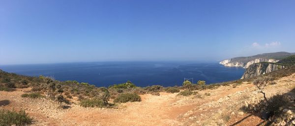 Scenic view of sea against clear blue sky