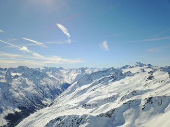 Scenic view of snowcapped mountains against sky