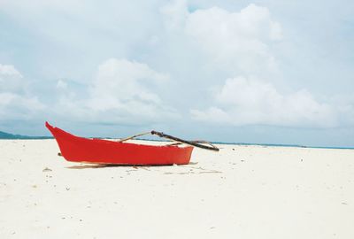 Lifeguard hut on beach against sky