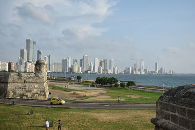 View of city against cloudy sky